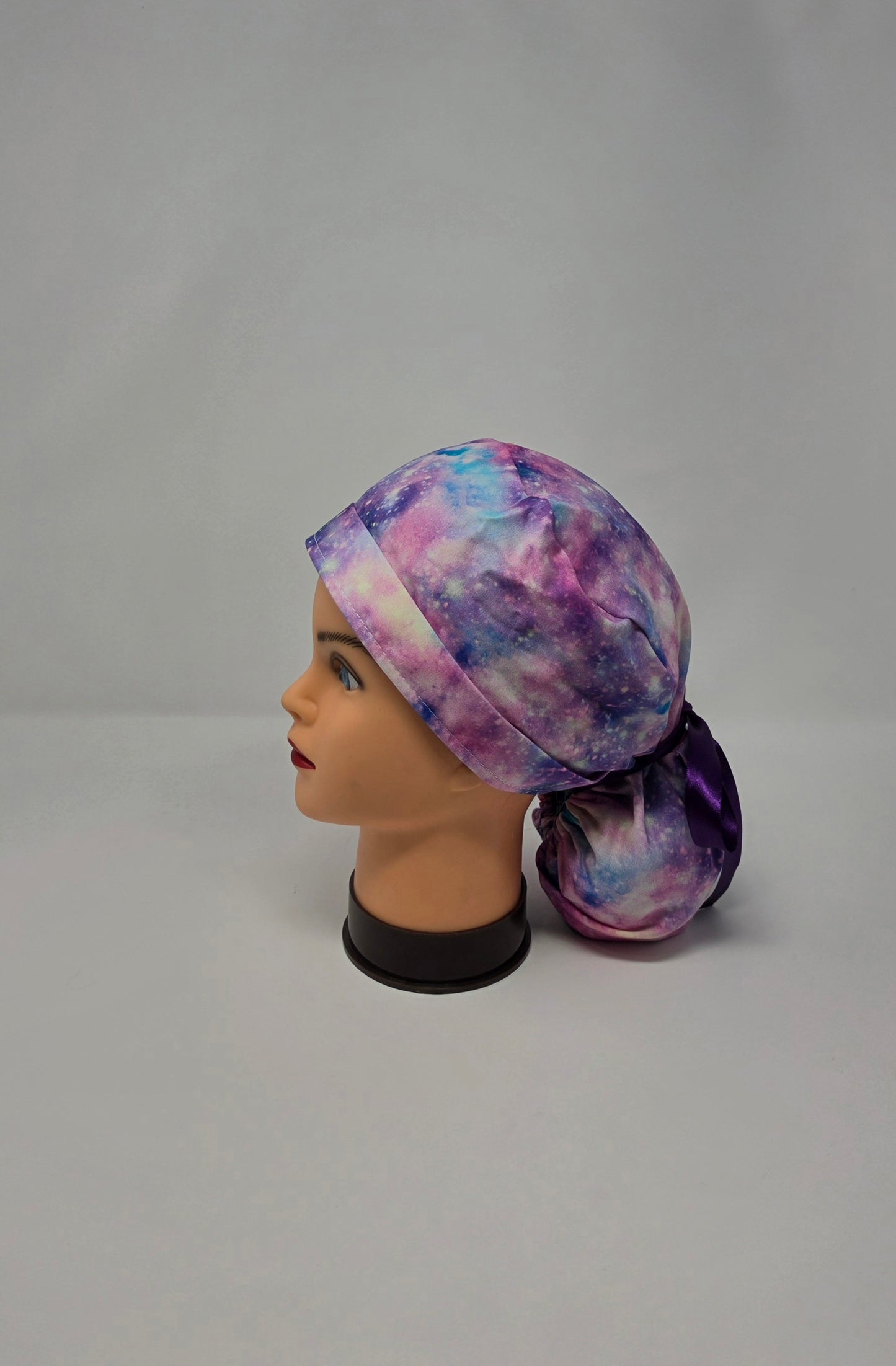 Ponytail Scrub Cap. Pink/Purple Galaxy With Purple Ribbon
