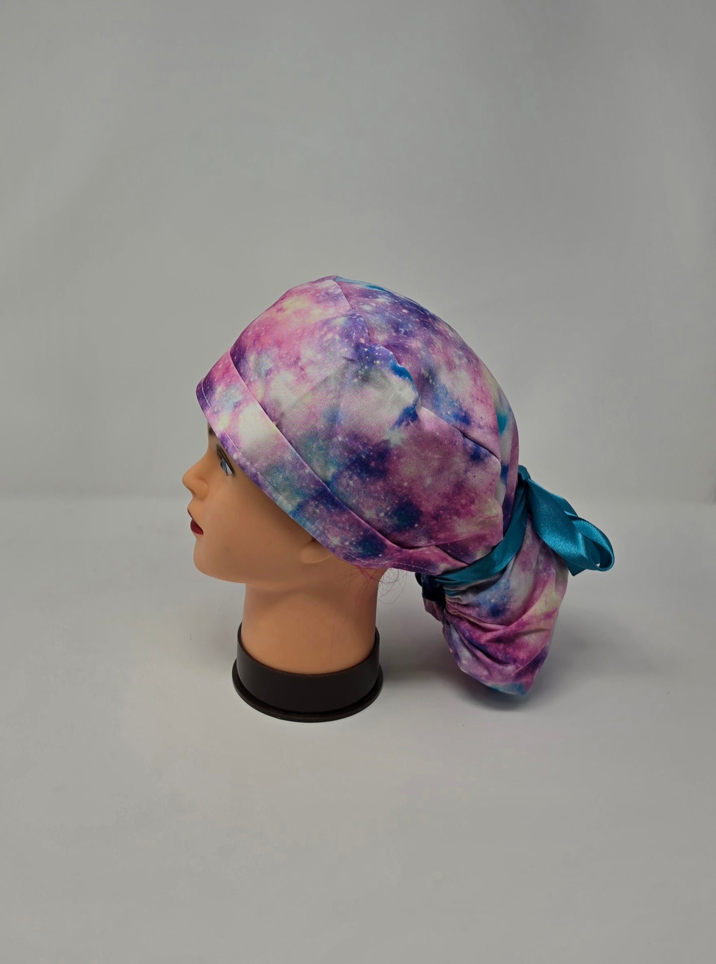 Ponytail Scrub Cap. Pink/Purple Galaxy with teal ribbon