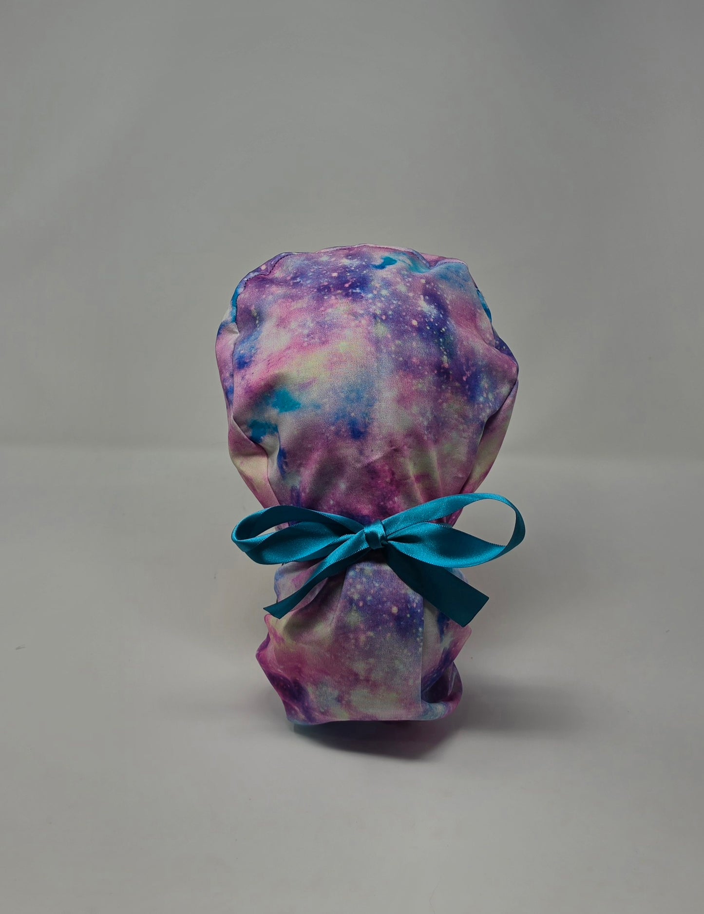 Ponytail Scrub Cap. Pink/Purple Galaxy with teal ribbon